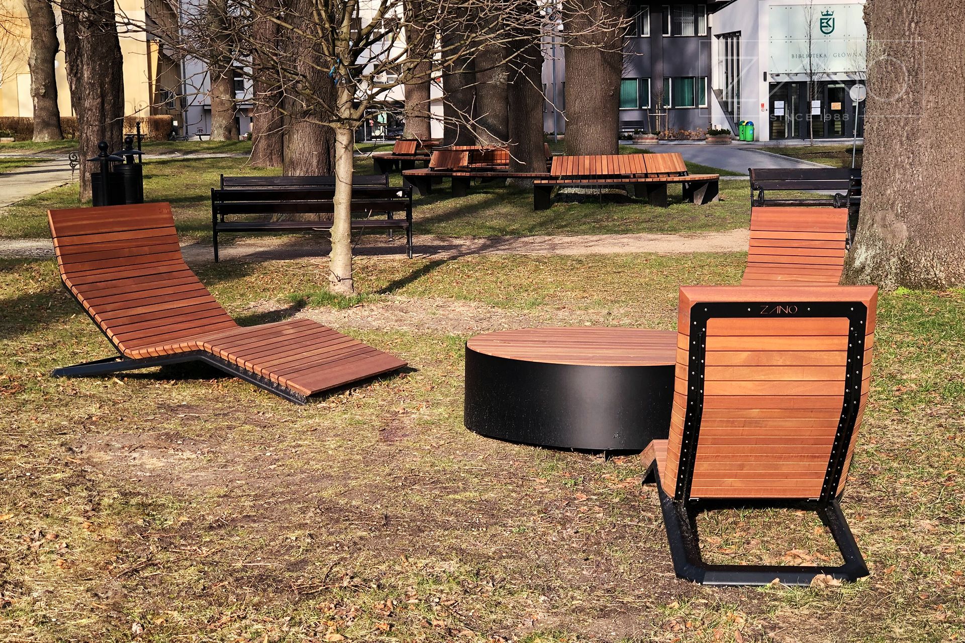 Urban space equipped with modern deckchairs and benches